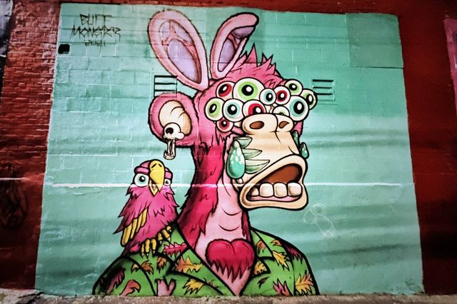 a colorful mural by the artist Buff Monster